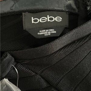 Bebe Sleek Black Knit jumpsuit Sz Xs.